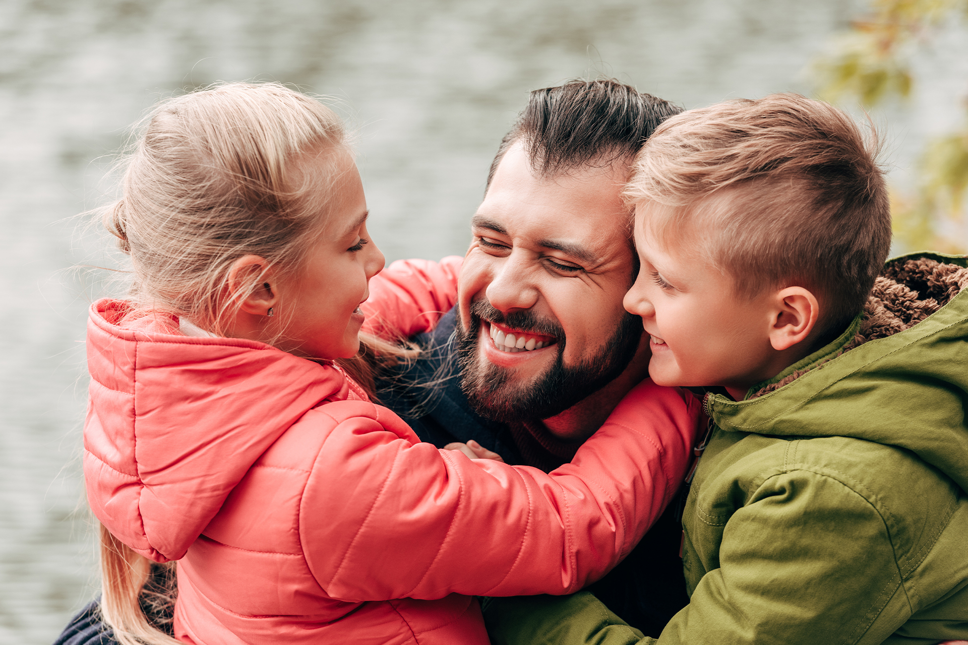 Kids hugging their dad
