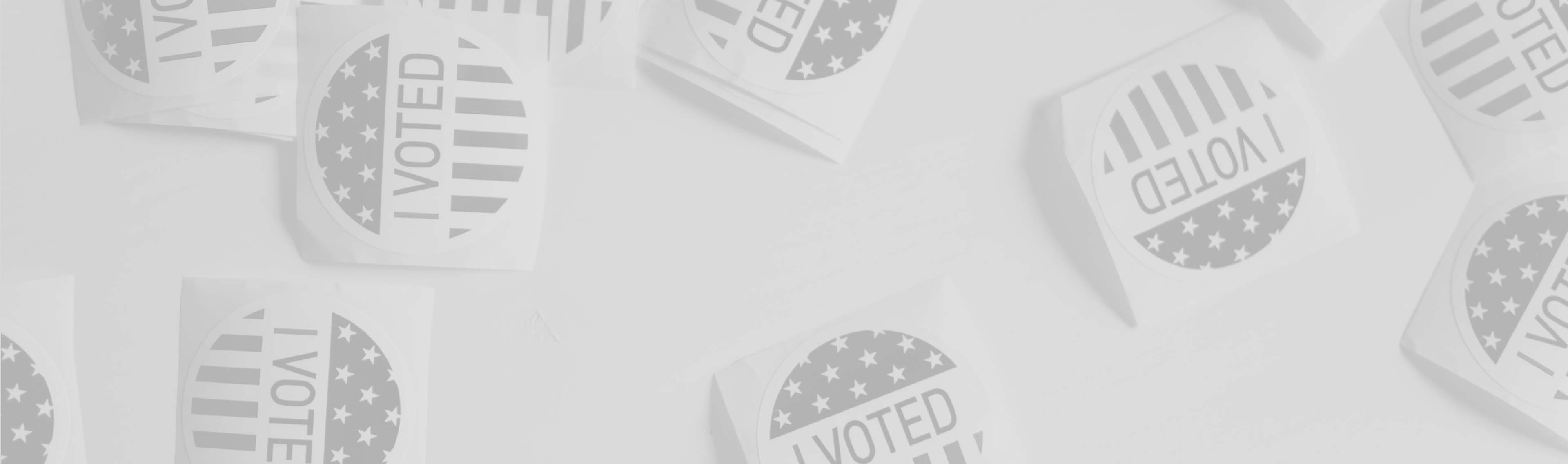 Voting stickers on a beige background.